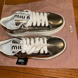 Miu Miu Silver Mirror Metallic Sneakers with White Soles and Pink Gem Accents